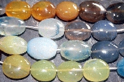 8399: Beaded black,orange,yellow onyx oval beads
