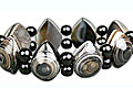 7484: Beaded black,brown,white black onyx stretch bracelets