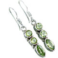 8867: Green peridot  danglers earrings