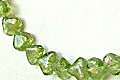 1394: Beaded green peridot heart necklaces