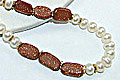 6486: Beaded white, brown, gold pearl necklaces