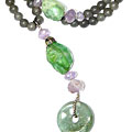 7944: Beaded green multi-stone  donut necklaces