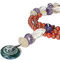 7946: Beaded orange,multi-color multi-stone donut necklaces