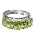 12437: green peridot  contemporary rings